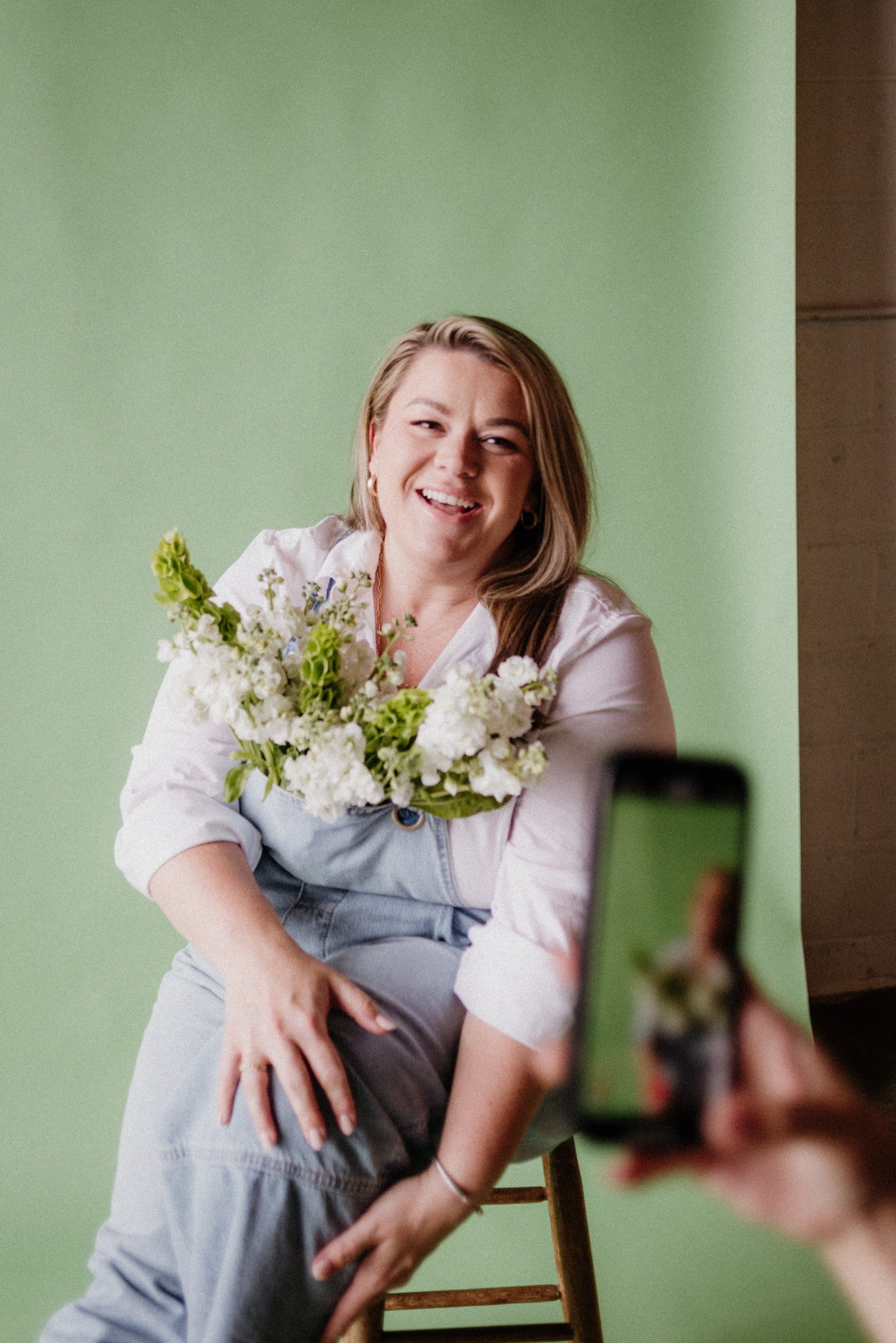 She Blooms florist with white flower bouquet